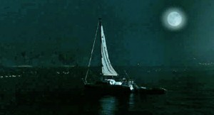 sailboat at night on lake