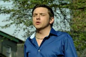 Graeme strutting in blue satin shirt