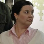 Mary, watching the partygoers