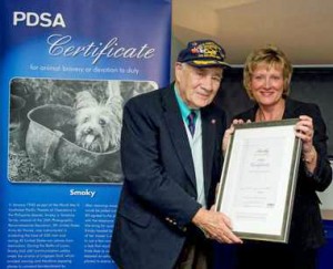 Bill Wynne accepting PDSA bravery award for Smoky