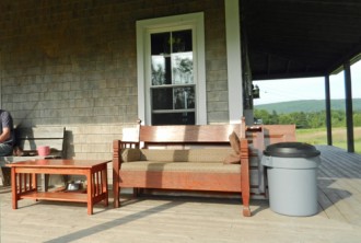 settee and table on house porch photo D Stewart