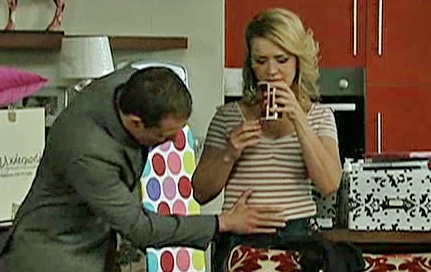 Nick patting Natasha's belly