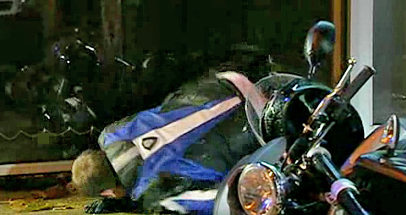 Steve, in his leathers, drops his bike while "leathered"