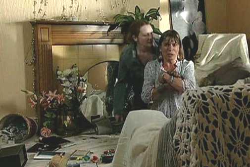 Charlotte cowering in smashed up living room - crazy ladies