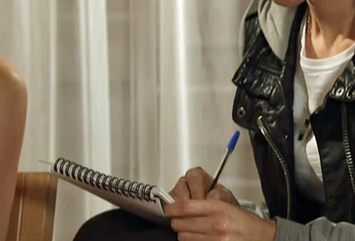 Becky writes down what Gail tells her about clinic computer