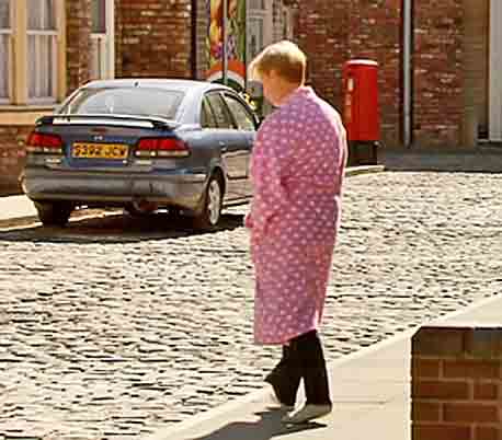 sally-in-bathrobe-on-street